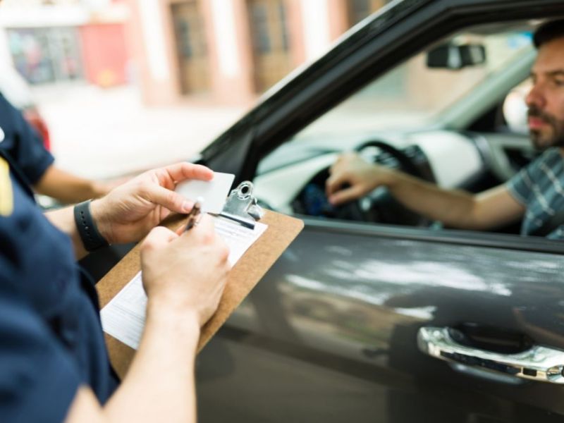 police officer giving a speeding ticket to a driver in virginia