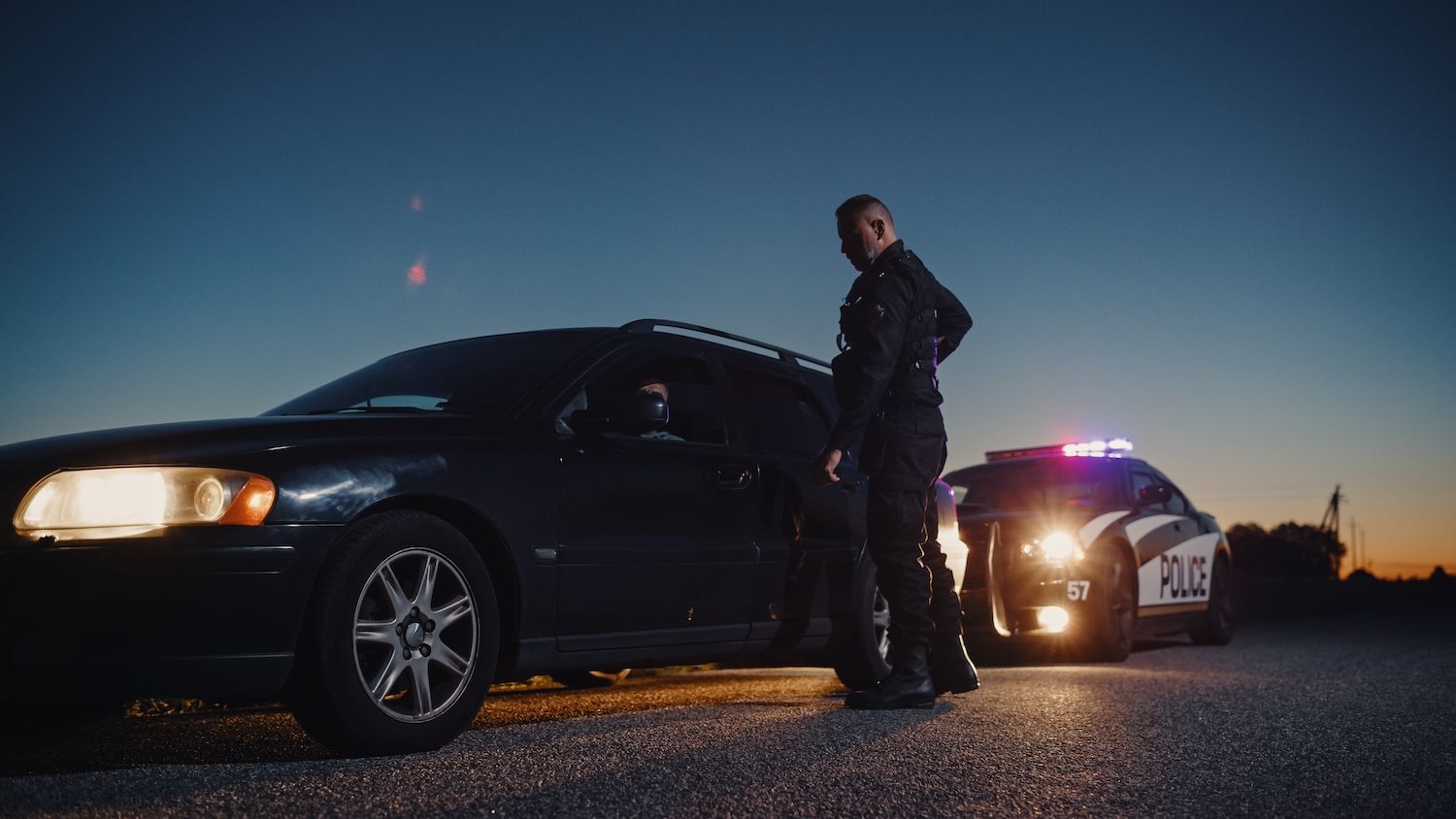 Car Being Stopped by an Officer to Inspect his Papers.