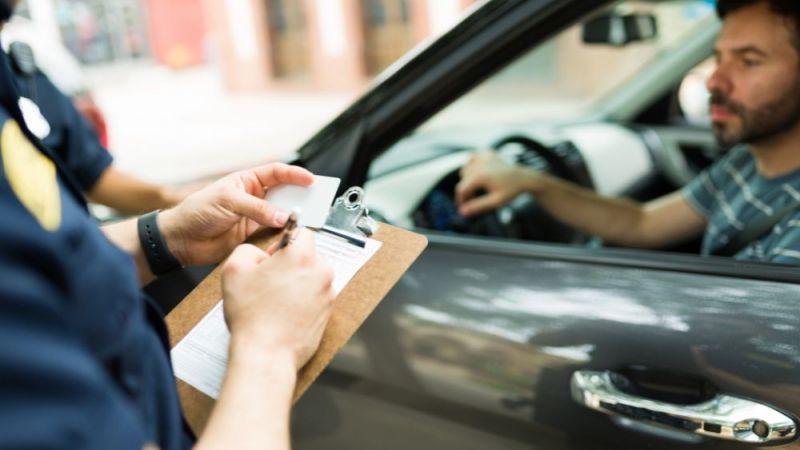 police officer giving a speeding ticket to a driver in virginia